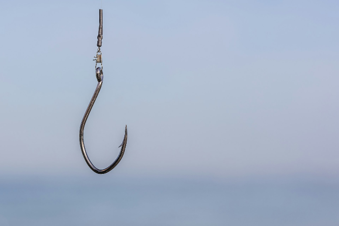 a fishing hook hanging from the side of a boat